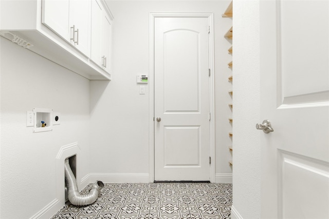 laundry room with cabinets, washer hookup, hookup for an electric dryer, and light tile patterned floors