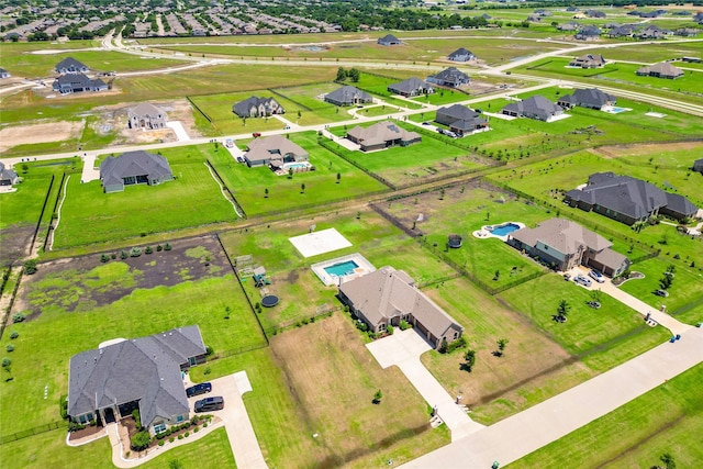 birds eye view of property with a rural view