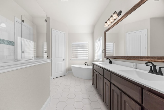 bathroom featuring plus walk in shower, tile patterned floors, and vanity