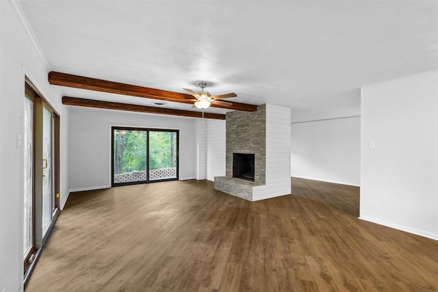 unfurnished living room featuring dark wood-type flooring, a fireplace, ornamental molding, and ceiling fan