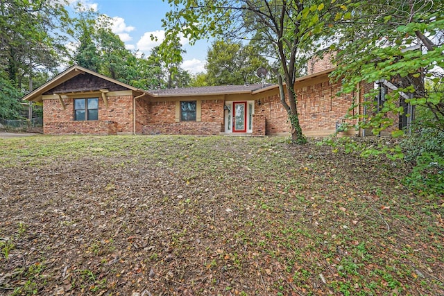 ranch-style home with a front yard