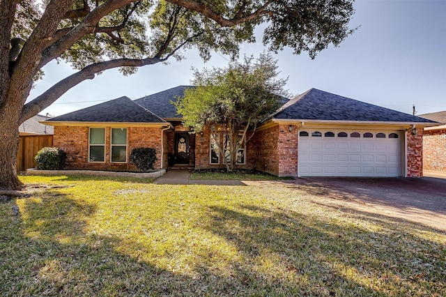 single story home with a garage and a front lawn