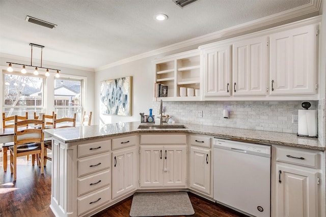 kitchen featuring dishwasher, white cabinetry, ornamental molding, decorative light fixtures, and kitchen peninsula