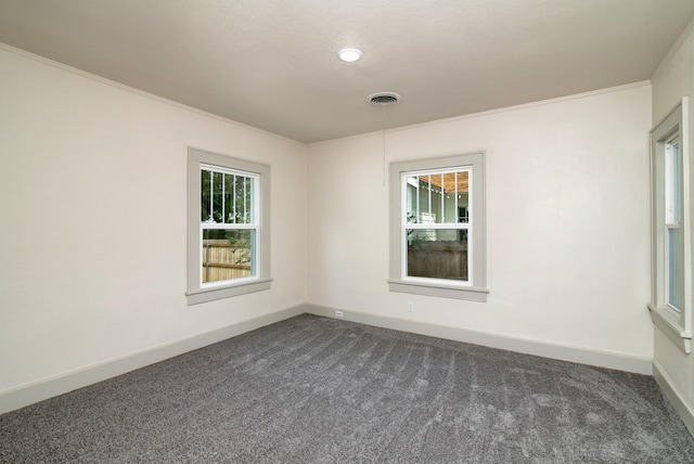 carpeted spare room with ornamental molding