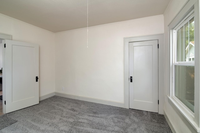 unfurnished room with light carpet