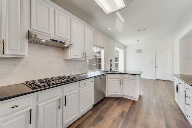 kitchen with ventilation hood, sink, white cabinets, kitchen peninsula, and stainless steel appliances