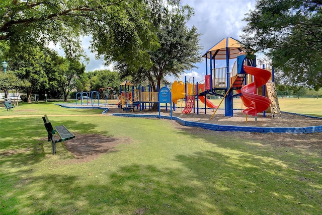 view of jungle gym featuring a lawn