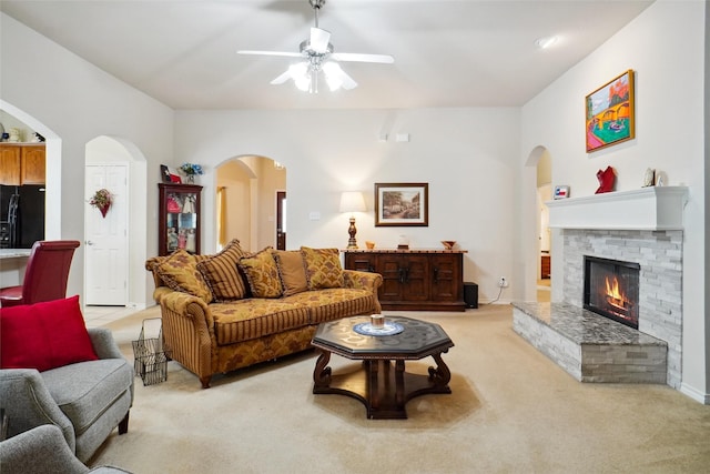 living room featuring light carpet and ceiling fan