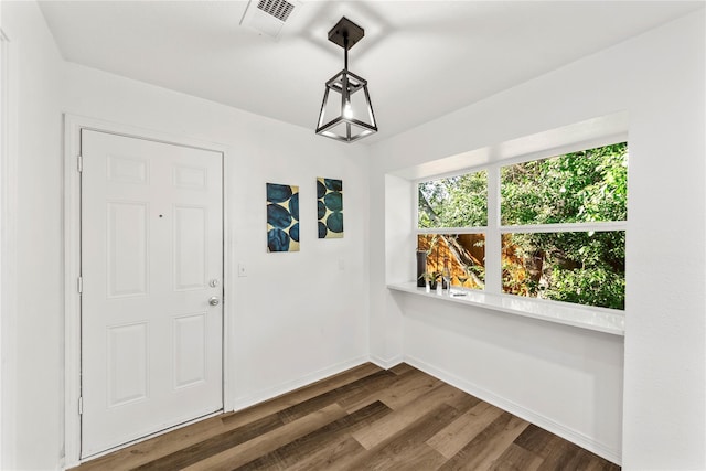 foyer entrance with dark hardwood / wood-style flooring