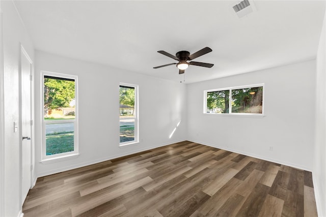 spare room featuring hardwood / wood-style floors and ceiling fan