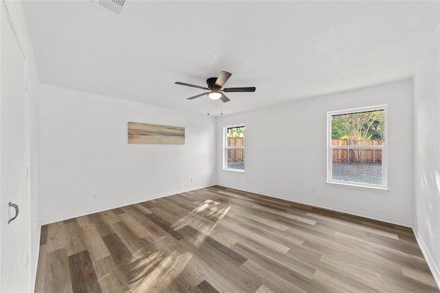 unfurnished room featuring ceiling fan and light wood-type flooring