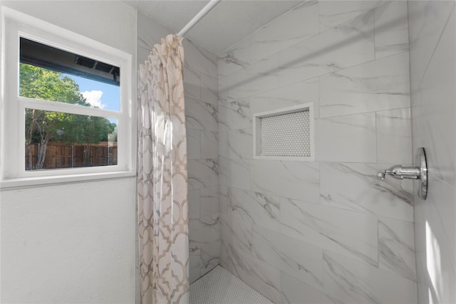 bathroom with a shower with curtain