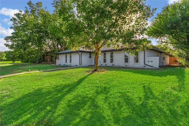 view of front of home with a front lawn