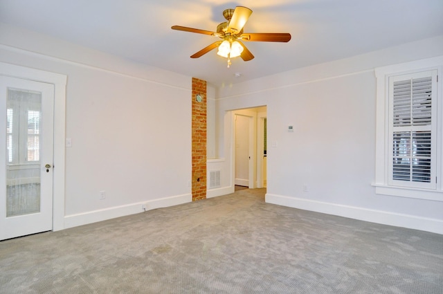 empty room with carpet and ceiling fan