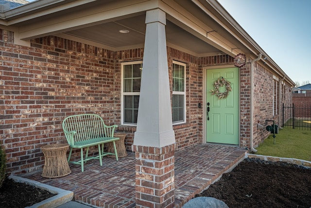 property entrance with brick siding