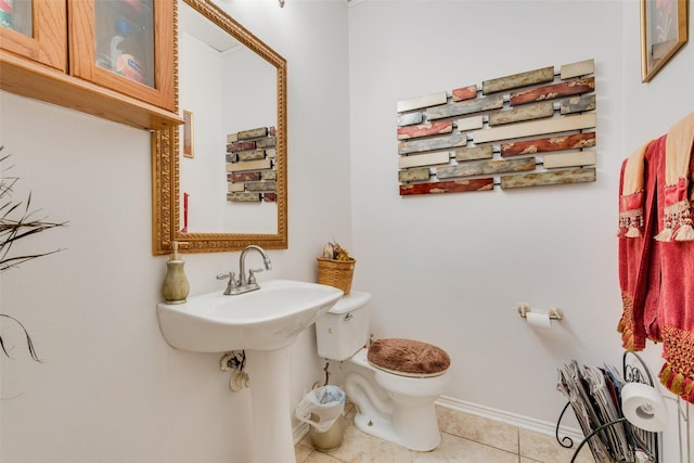 bathroom featuring tile patterned floors and toilet