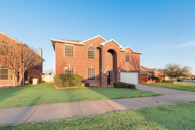 view of front of house with a garage and a front yard