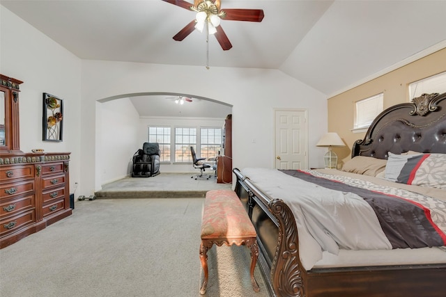 carpeted bedroom featuring multiple windows, vaulted ceiling, and ceiling fan