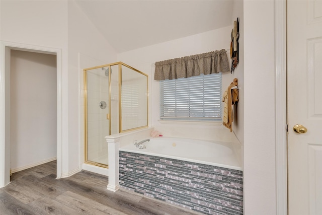 bathroom with vaulted ceiling, plus walk in shower, and wood-type flooring