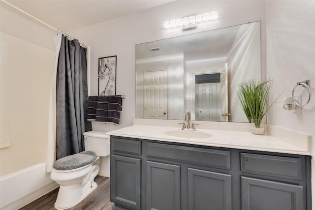 full bathroom featuring shower / bathtub combination with curtain, wood-type flooring, vanity, and toilet