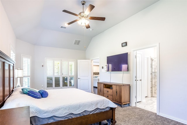 carpeted bedroom with ceiling fan, ensuite bath, and vaulted ceiling