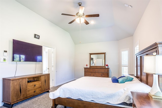 carpeted bedroom with ceiling fan and lofted ceiling