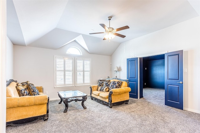 living room featuring ceiling fan, lofted ceiling, and carpet