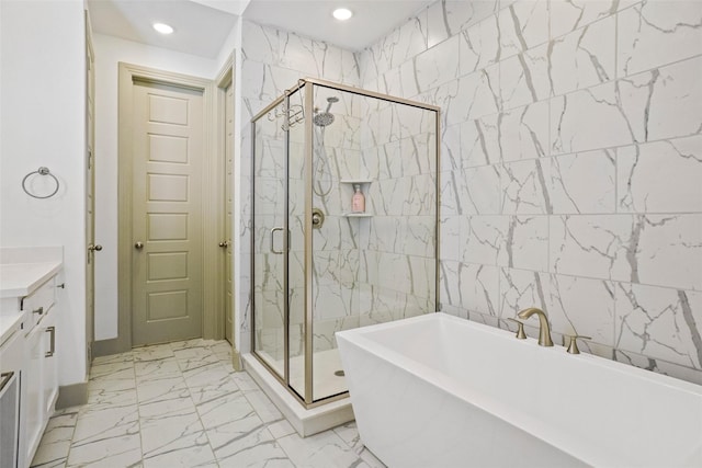 bathroom featuring vanity, plus walk in shower, and tile walls