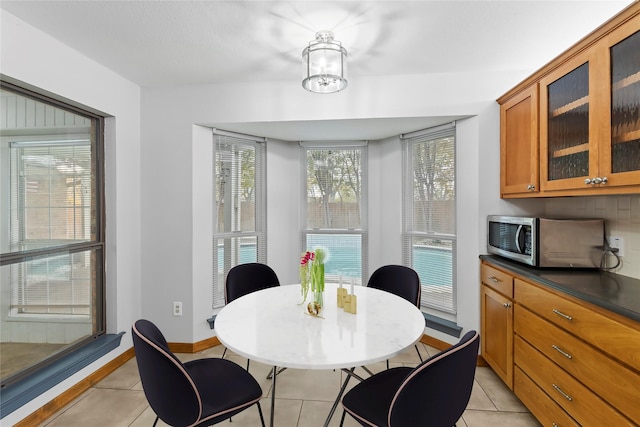 dining area featuring light tile patterned floors