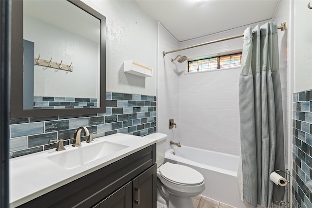 full bathroom featuring shower / bath combination with curtain, vanity, toilet, and tile walls