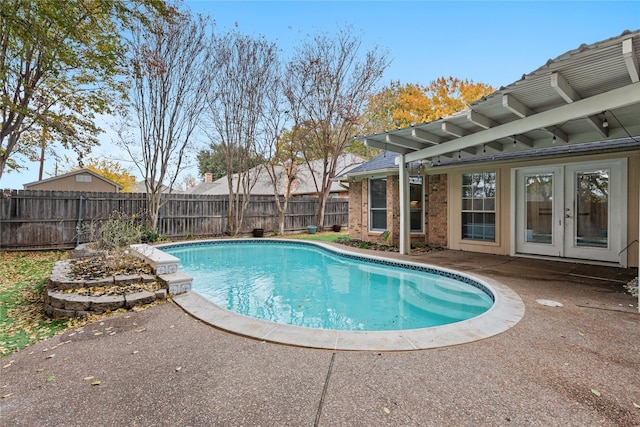 view of pool featuring a patio, a pergola, and french doors