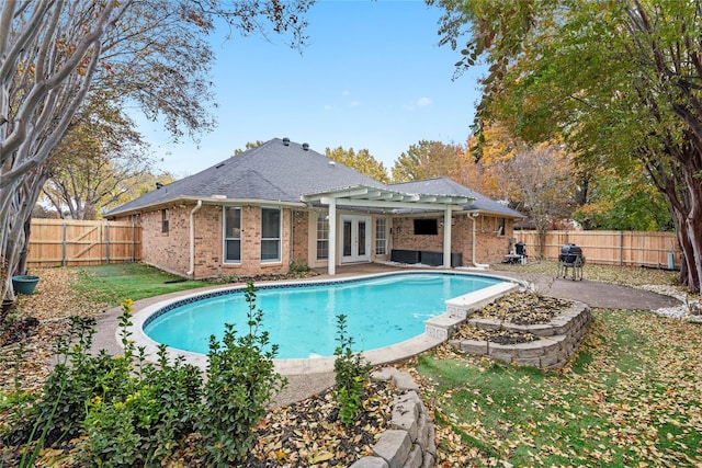 view of pool with a patio and french doors