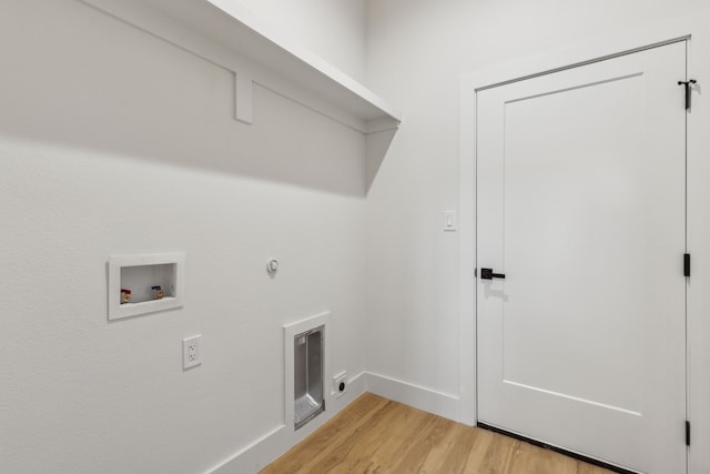 laundry room with hookup for a washing machine and light hardwood / wood-style floors