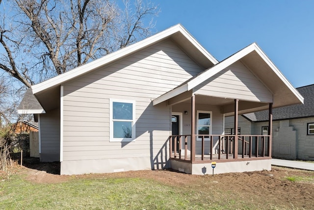 view of front of home with a front lawn and a porch