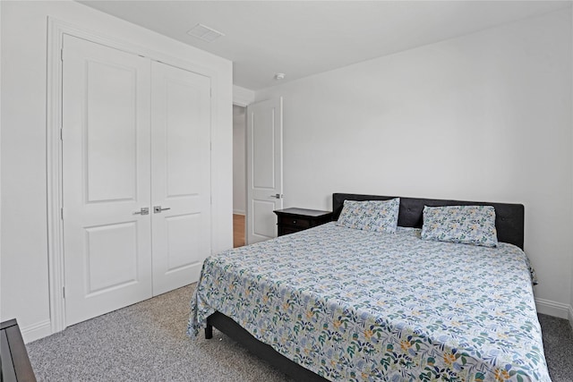 bedroom with carpet floors and a closet