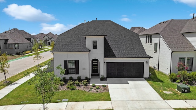 french country home with a garage and a front lawn