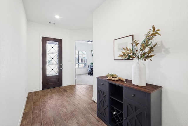 entryway with wood-type flooring