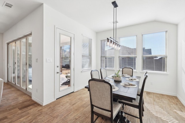 dining area featuring a healthy amount of sunlight and light wood-type flooring