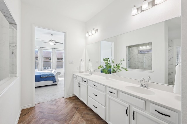 bathroom with parquet floors, ceiling fan, and vanity