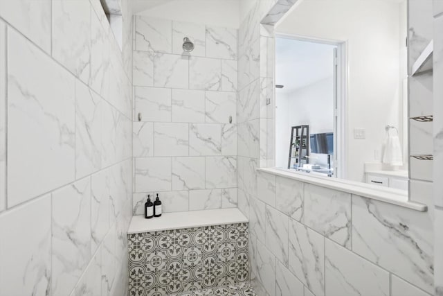 bathroom with a tile shower