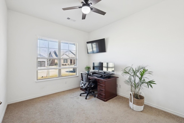 home office featuring light colored carpet and ceiling fan