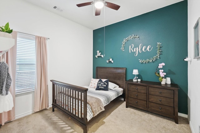 bedroom featuring ceiling fan and light colored carpet