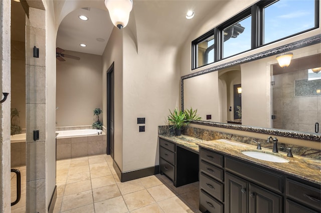 bathroom featuring vanity, tile patterned flooring, plus walk in shower, and ceiling fan