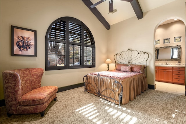 bedroom with ensuite bathroom, high vaulted ceiling, light tile patterned floors, beamed ceiling, and ceiling fan