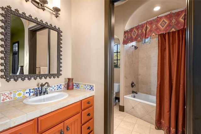 full bathroom featuring tile patterned flooring, vanity, shower / bath combination with curtain, and toilet