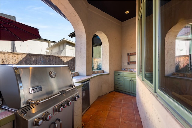 view of patio with grilling area and exterior kitchen