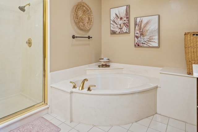 bathroom featuring tile patterned flooring and independent shower and bath