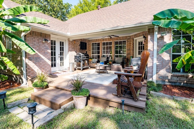 view of patio featuring grilling area, french doors, ceiling fan, and a deck