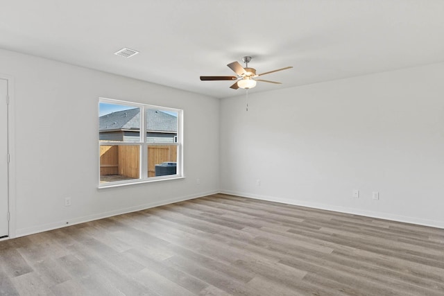 spare room featuring ceiling fan and light wood-type flooring