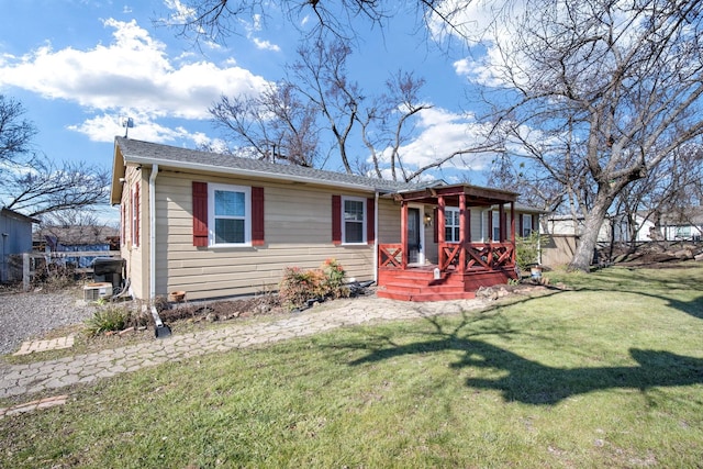 view of front of property with a front lawn and a porch